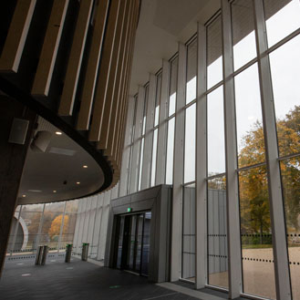 The glass façade entrance to our new sports facilities