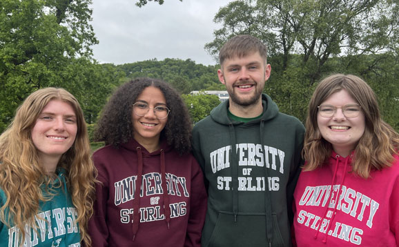 Four sabbatical officers wearing University of Stirling jumpers
