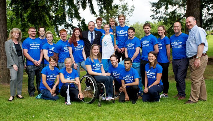 The First Minister and Team Scotland athletes welcome the Queen’s Baton to the Team Camp at the University of Stirling. 
