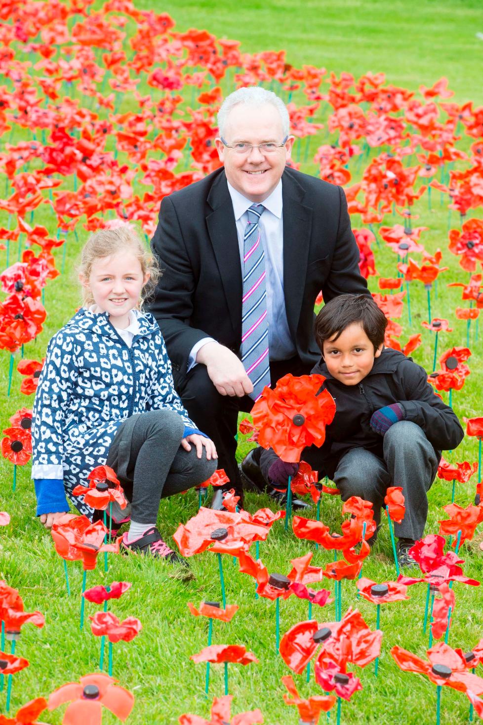 Pupils and the Principal at the WW1 Battle of Gallipoli poppy display